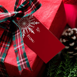 Weiße Schneeflocke am roten Weihnachtsfeiertag Geschenkanhänger