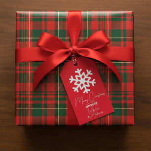 Weiße Schneeflocke auf rotem Weihnachten Neujahr Geschenkanhänger