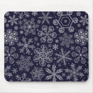Weiße Schneeflocken auf blau Mousepad