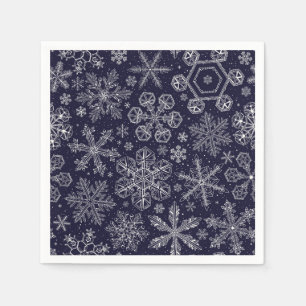 Weiße Schneeflocken auf blau Serviette