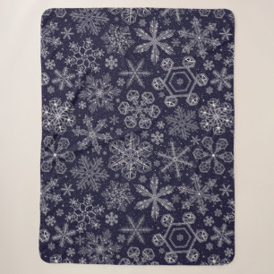 Weiße Schneeflocken auf blau Sherpadecke