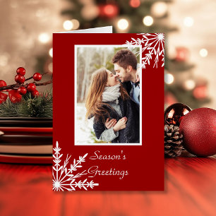 Weiße Schneeflocken auf den Grüßen der Roten Jahre