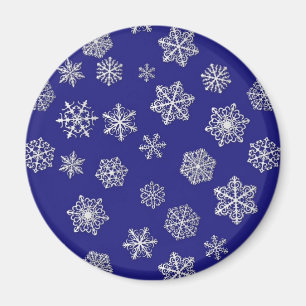 Weiße Schneeflocken gegen tiefblaues Kobalt Magnet