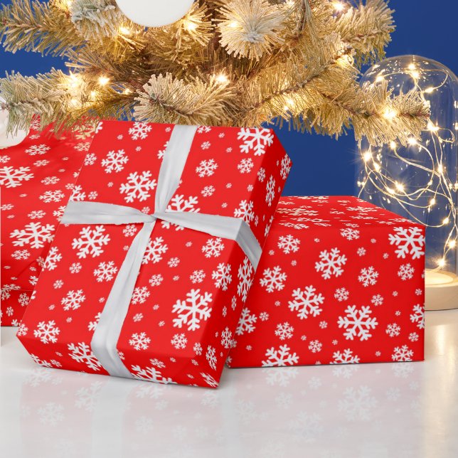 Weiße Schneeflocken im roten Wintermuster Geschenkpapier (Feiertage)