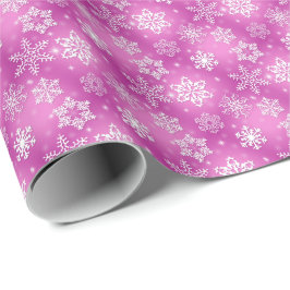 weiße Schneeflocken in rosa Geschenkpapier