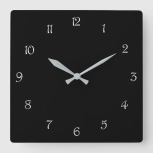 Weiße Schriftzeichen auf der schwarzen Wall-Uhr Quadratische Wanduhr