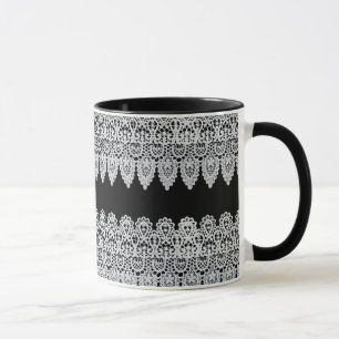 Weiße Spitze bildet eine empfindliche Grenze gege Tasse