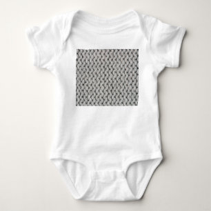 Weiße Strickwollestruktur, nahes Foto. Baby Strampler