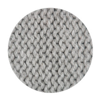 Weiße Strickwollestruktur, nahes Foto. Schneidebrett