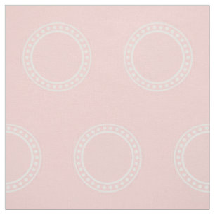 Weiße Tupfen-Ringe auf Baby-Rosa Stoff