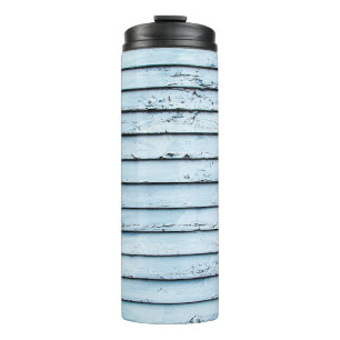 Weiße und blaue Holzoberfläche Thermosbecher