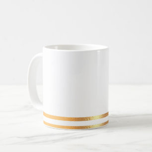Weiße und goldene Tasse