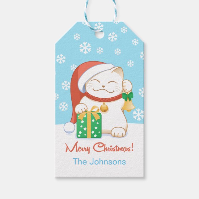 Weiße Weihnachtskatze in einem Red Hat Geschenkanhänger (Vorderseite)
