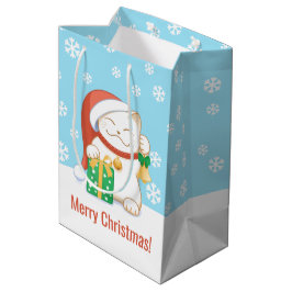 Weiße Weihnachtskatze in einem Red Hat Mittlere Geschenktüte