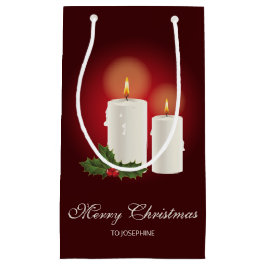 Weiße Weihnachtskerzen auf Rot mit individuellem T Kleine Geschenktüte