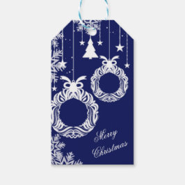 Weiße Weihnachtsschmuckkleider auf blau Geschenkanhänger