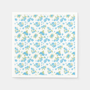 weißer Hintergrund mit blauen Blumen und grünem Le Serviette