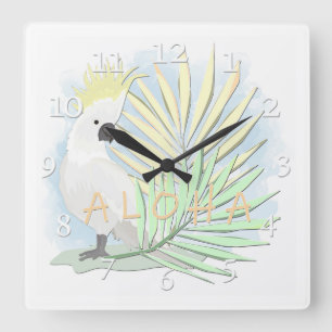 Weißer Papageiencockatoo in Blätter aus Palmen. Quadratische Wanduhr