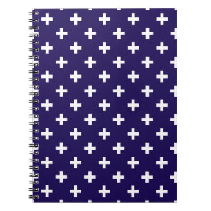 Weißer Polka kreuzt auf marineblau Notizblock