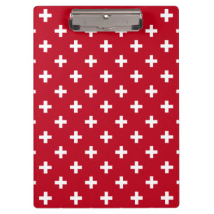 Weißer Polka kreuzt auf rot Klemmbrett
