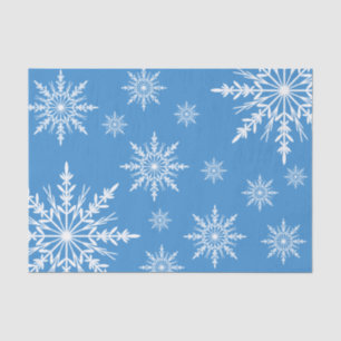 Weißer Winter Schneeflocken auf blau Seidenpapier