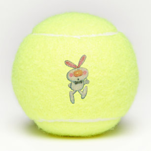 Weißes Kaninchen Orangennase wirbelt schwarze Kraw Tennisbälle