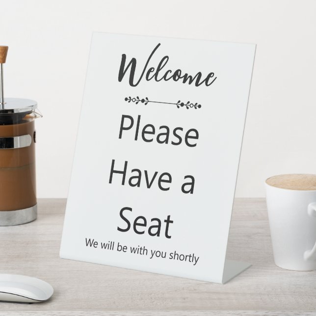 Welcome Please Have a Seat White and Black Sockelschild (In SItu)