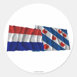 Wellenartig bewegende Flaggen der Niederlande u. Runder Aufkleber