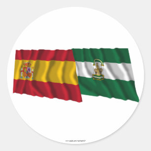 Wellenartig bewegende Flaggen Spaniens und Runder Aufkleber