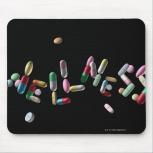 "WELLNESS" geschrieben mit Pillen Mousepad