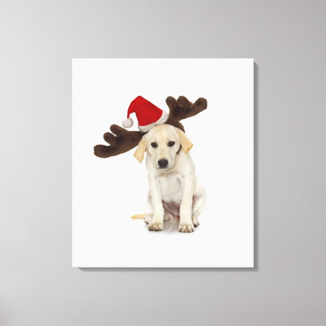 Welpe mit Weihnachtsmannmütze und Rentier Leinwanddruck (Vorderseite)