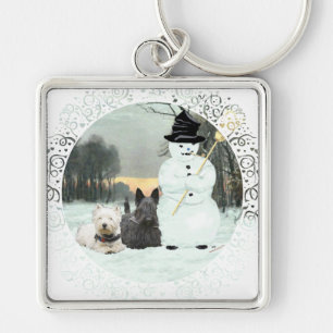 Westie und Scottie bauen einen Schneemann Schlüsselanhänger