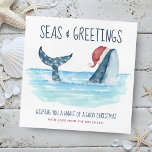 Whale Santa Sea Schöne Weihnachten<br><div class="desc">Die Weihnachtskarte des Nautical Spaß ist mit einem Aquarellwal ausgestattet,  der eine Weihnachtsmannmütze trägt,  die im Meer schwimmt und dessen Schwanz mit Streichlichtern geschmückt ist. Die Grüße "Seas & Greetings" und "Einen Wal von einem guten Weihnachtsfest wünschen",  zusammen mit dem Namen können personalisiert sein. Kunst von KL Stock</div>