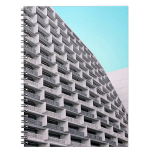 White concrete building with terraces notizblock