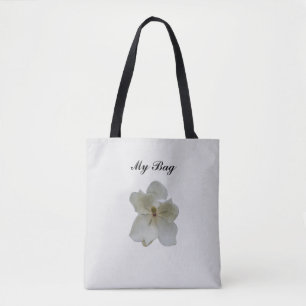 White Magnolia-Blume auf der Tasche "All Over Prin