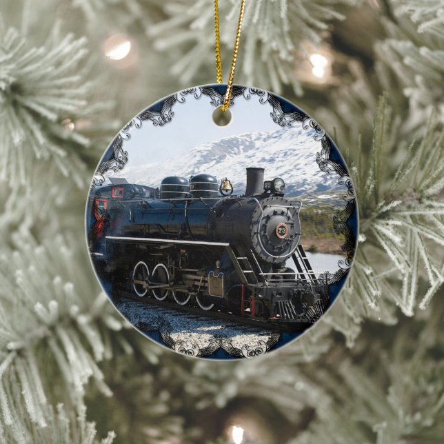 White Pass Zug in Snow Ornament (Old-fashioned train, ceramic Christmas ornament with blue edging.)