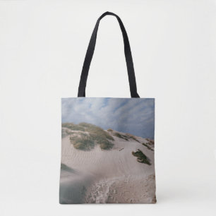 WHITE SAND AND GREEN GRASS FIELD TASCHE