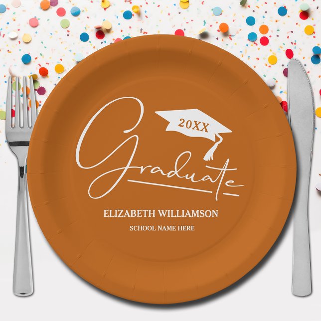 White Script Graduation Cap Burnt Orange Pappteller (Your name, year, grad cap and "Graduate" in a cool script on burnt orange school color paper plates)