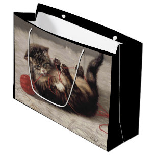 Wiegenlied der Katze, Eine Katze spielt mit einem  Große Geschenktüte