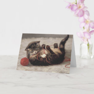 Wiegenlied der Katze, Eine Katze spielt mit einem  Karte