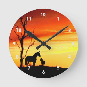 Wild Mustang Mare and Foal Silhouette With Sunset Runde Wanduhr