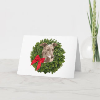 Windhund im Weihnachtskranz Feiertagskarte