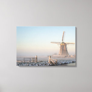 Windmühle im Schnee am Sonnenaufgang-Leinwanddruck Leinwanddruck