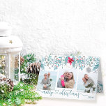 Winter Foliage 3 Foto Elegante Script Holiday Card Feiertagskarte<br><div class="desc">Personalisierte Weihnachtskarte mit 3 Fotos und eleganter Schriftzeichen. Aquarellgestaltung mit Poinsettia und Winterfolien in Blautönen,  Grau und Gewässer. Die Fotovorlage zeigt Ihre Fotos automatisch im quadratischen Format an. Sie können auch das Jahr an die Vorderseite und eine benutzerdefinierte Nachricht im Inneren.</div>