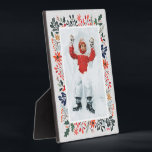 WinterFoto Fotoplatte<br><div class="desc">Auf JEDEM FARBHINTERGRUND (wir zeigen blau) zeigt Tabletop Foto Easel Ihr LieblingsFoto, umgeben von Schnee- und Winterschnee-Blume - Poinsettias, Beeren und Blätter. Ändern Sie das JAHR (unten rechts) oder es kann gelöscht werden. Gut als Geschenk oder um Ihr Lieblings-Foto in Ihrer eigenen Zuhause zu zeigen. Ihre Bildfarben werden direkt auf...</div>