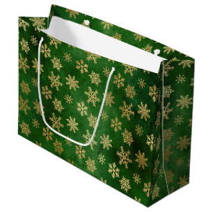 Winterschneeflocken bei festlichen Grün- und Goldf Große Geschenktüte