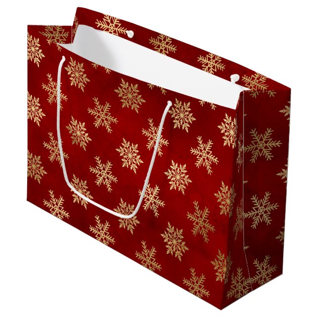 Winterschneeflocken in Rot und Gold Große Geschenktüte (Vorderseite Schrägansicht)