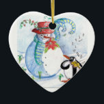 WINTERSERENADE VON SNOWMAN UND PENGUIN KERAMIKORNAMENT<br><div class="desc">Whimsikale,  farbenfrohe,  pastellfarbene Malerei in blauen Rottönen,  Schneemann und Pinguin im Winterschnee mit roten Blume, Schnörkel.von Bulgan Lumini (c)</div>