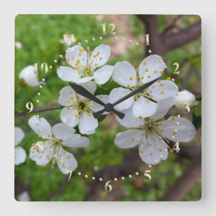 winzige weiße Blume Quadratische Wanduhr