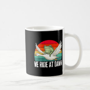 Wir reiten im Morgengrauen Lustiger Frosch reitet Kaffeetasse